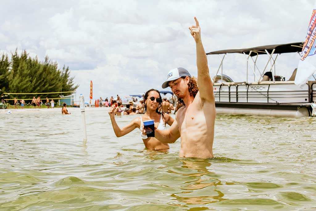Guy in water with a hot girl near Beer Can Island in Tampa Bay, FL.