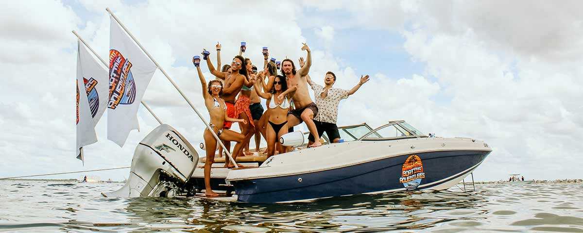 Group of friends partying on a boat in Tampa Bay, FL.