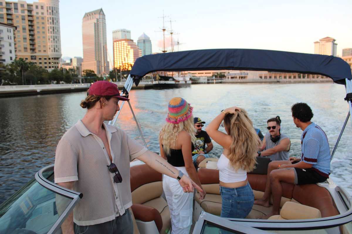 Friends on deck at golden hour along the Channelside waterfront.
