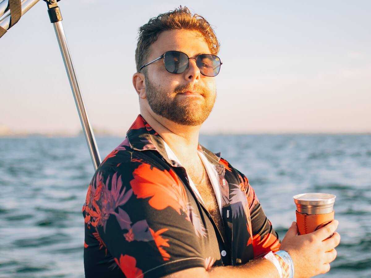 Guest relaxing with a drink on board.