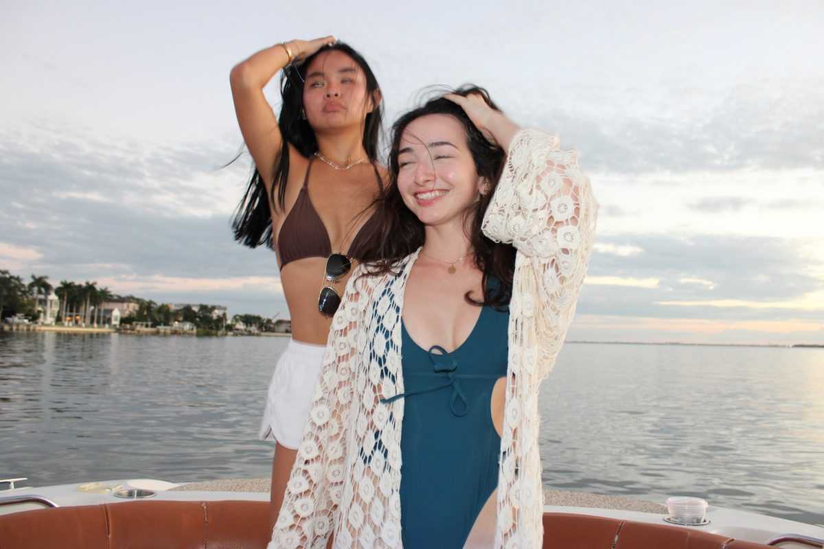 Friends dancing on the bow on Tampa Bay.