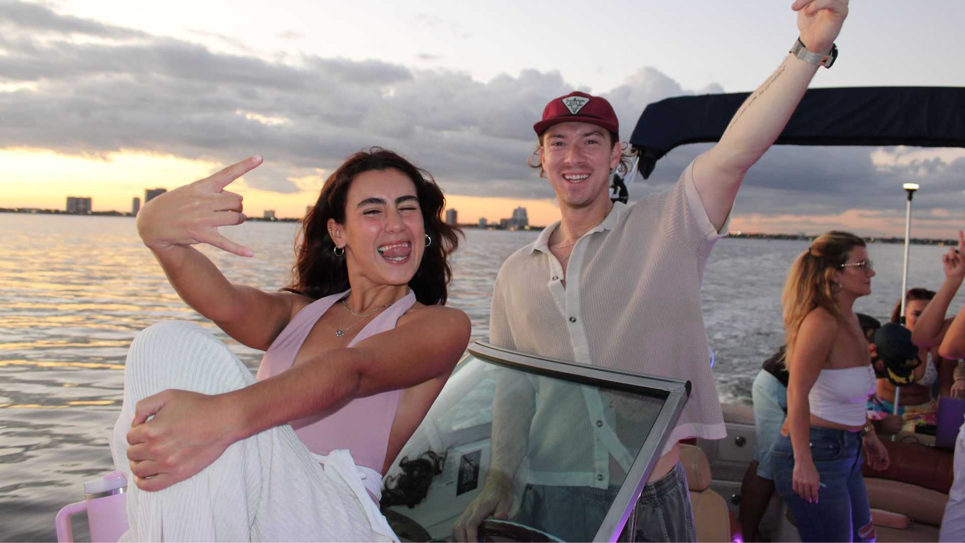 Group of friends partying on a boat in Tampa Bay, FL.