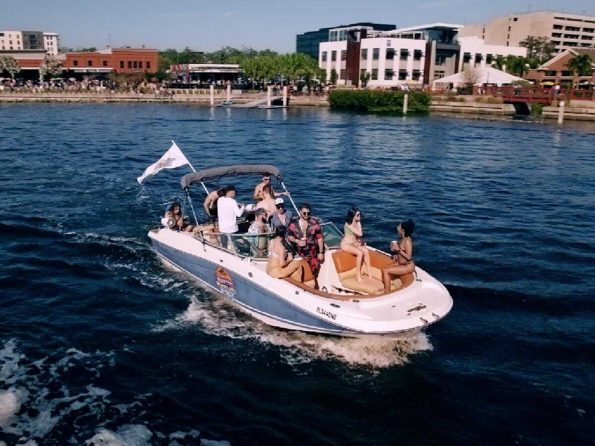 Drone shot of a private party boat in front of Downtown Tampa.