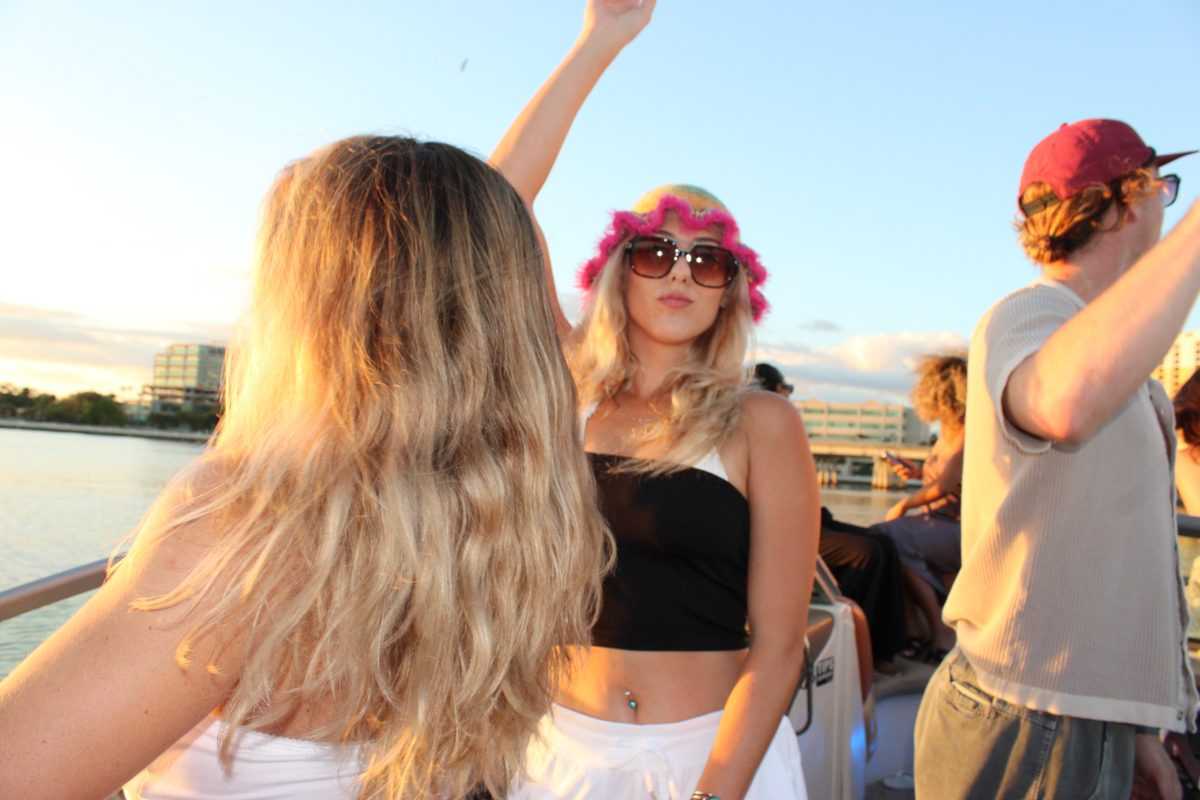 Dancing on deck as the sun sets behind downtown Tampa.