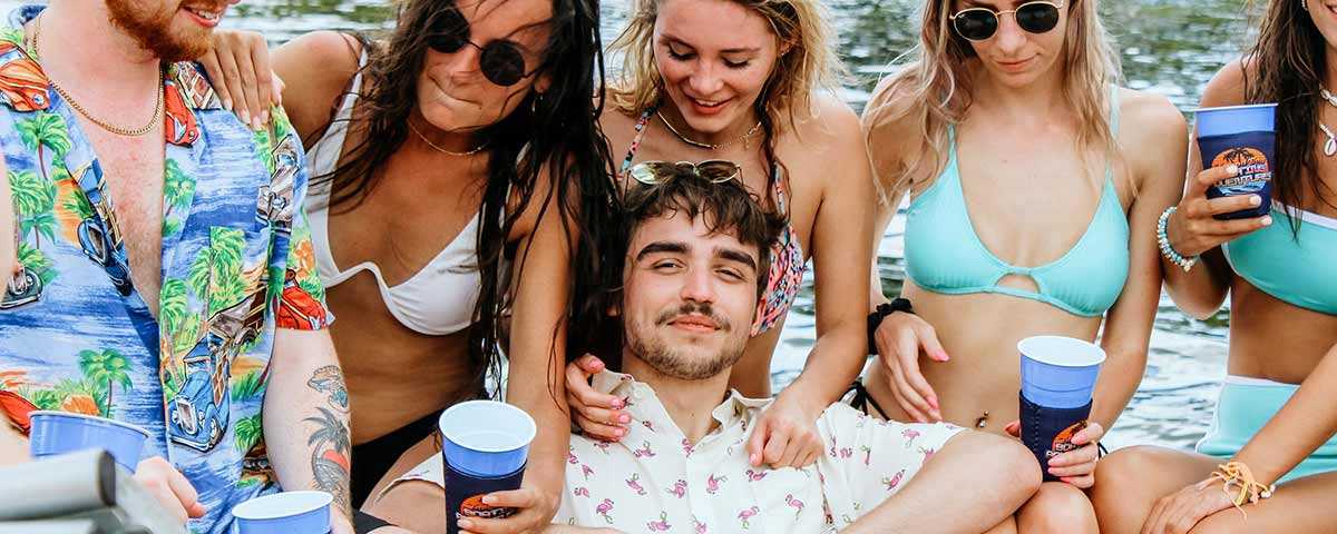 Guy chilling on a boat with hot girls in Tampa Bay, FL.