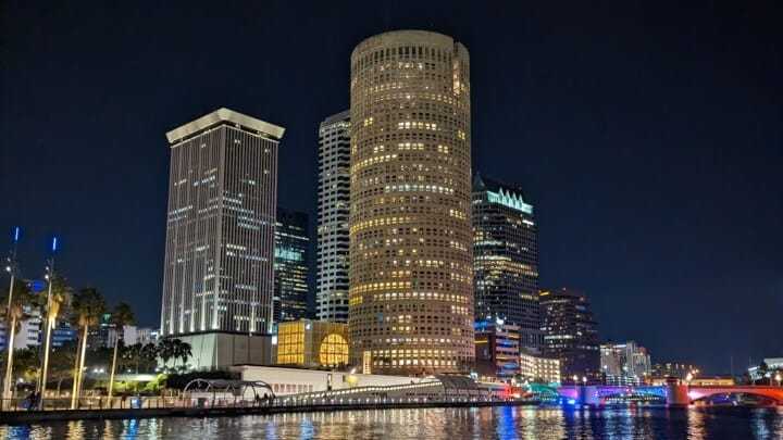 Downtown Tampa skyline lit up at night from the water.