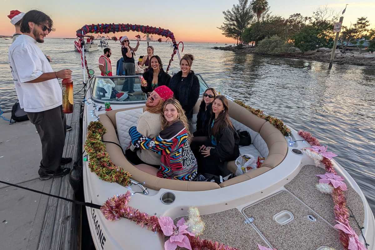 The charter boat decorated for Christmas at the dock.