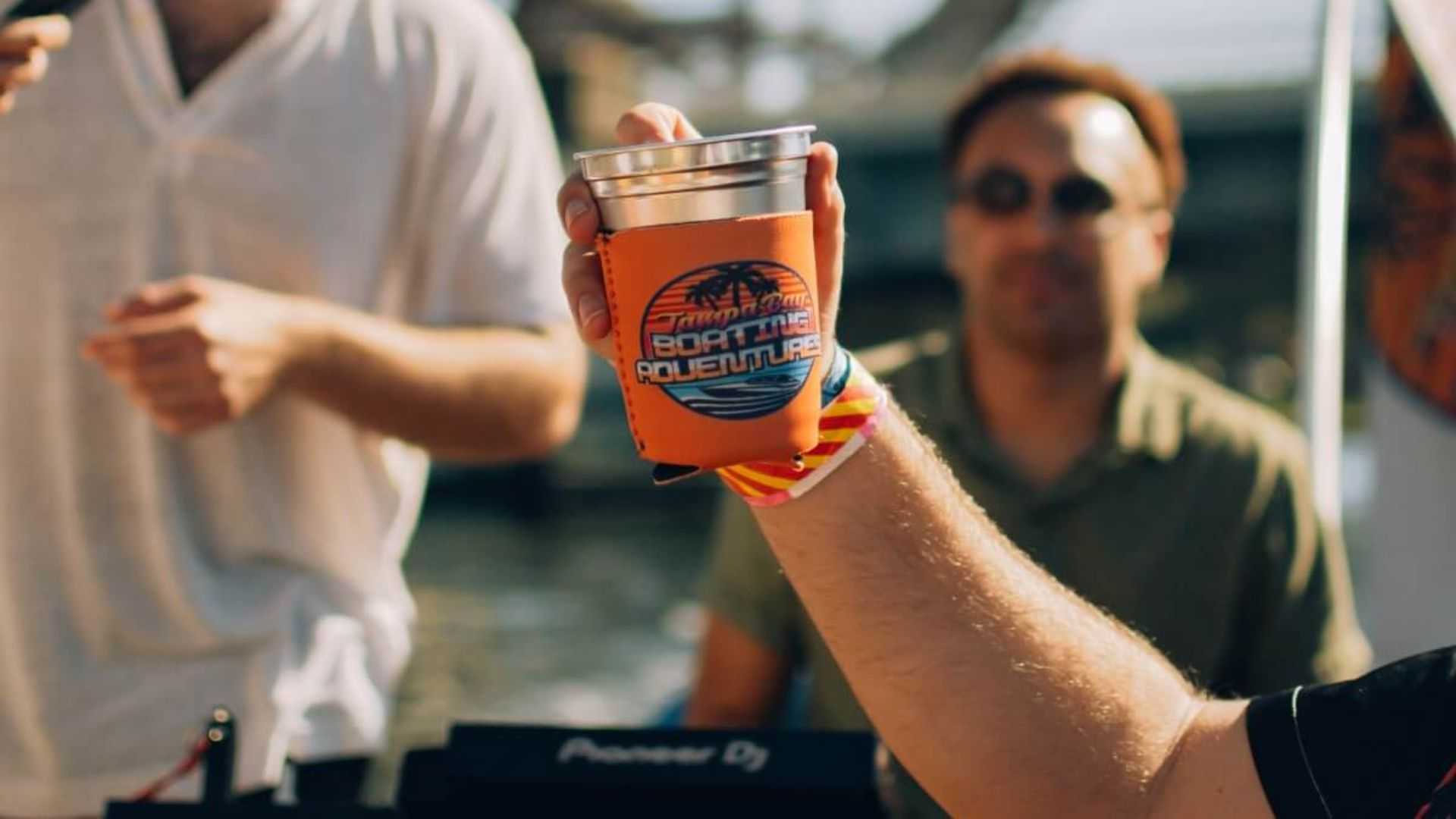 Bachelor group bar hopping along the Tampa Riverwalk from a boat.