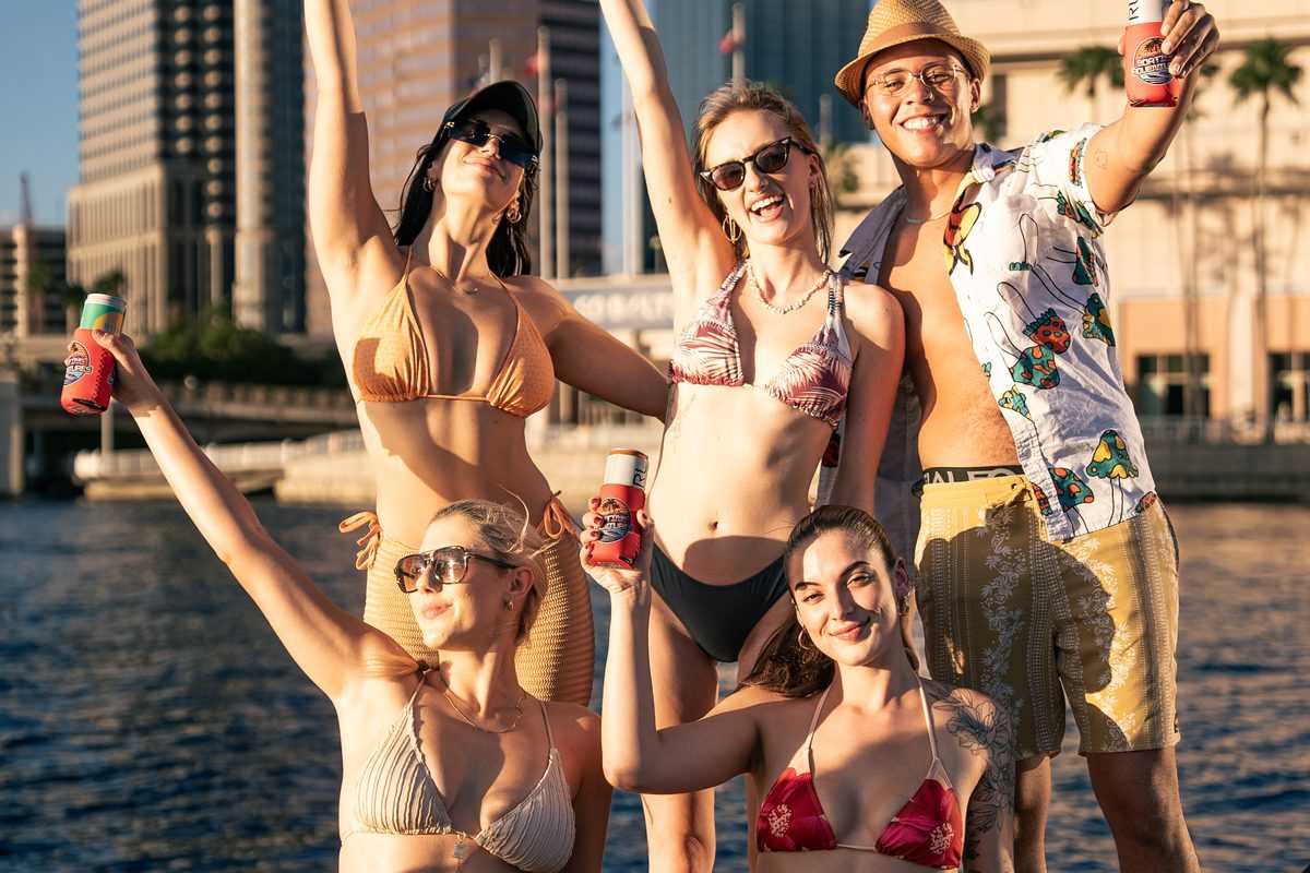 Friends cheering with the downtown Tampa skyline behind them.