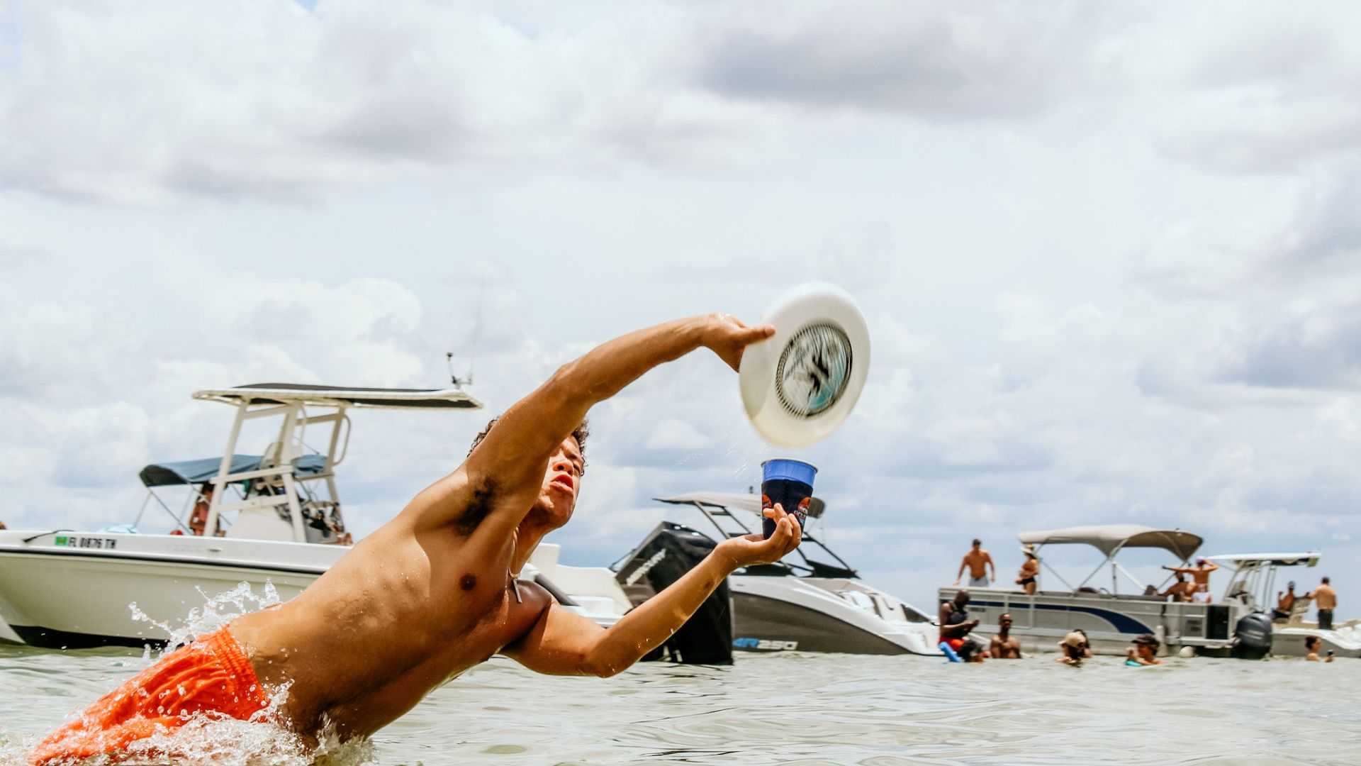 Friends swimming and floating near a local island in Tampa Bay.