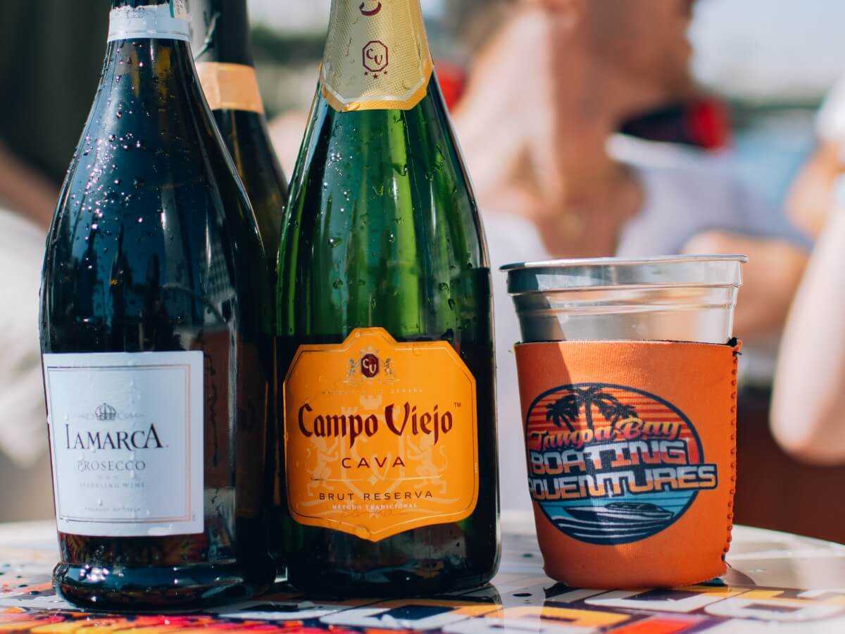 Champagne and a Tampa Bay Boating Adventures koozie at Channelside.