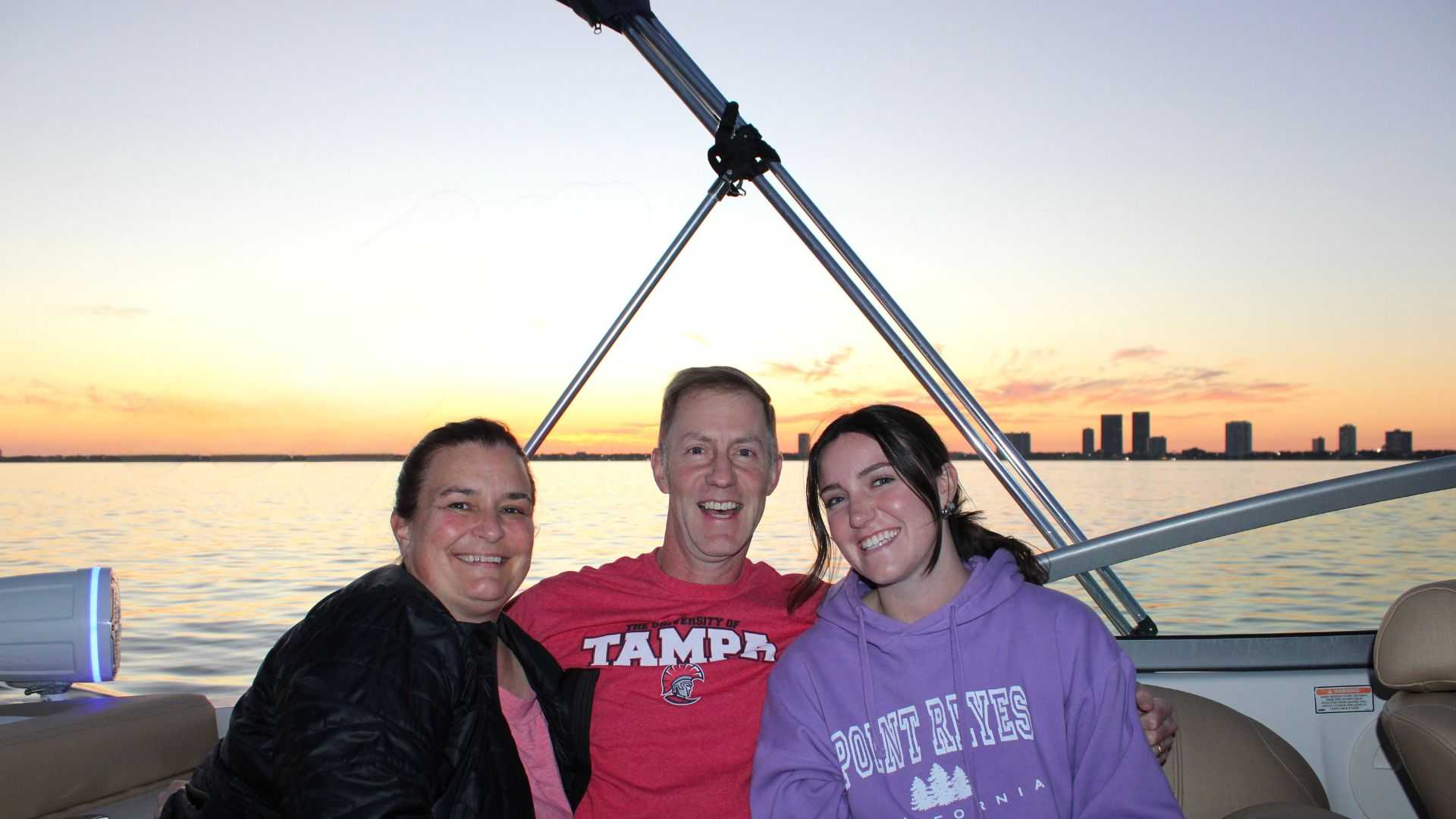 Friends talking on a party boat in Tampa Bay, FL.