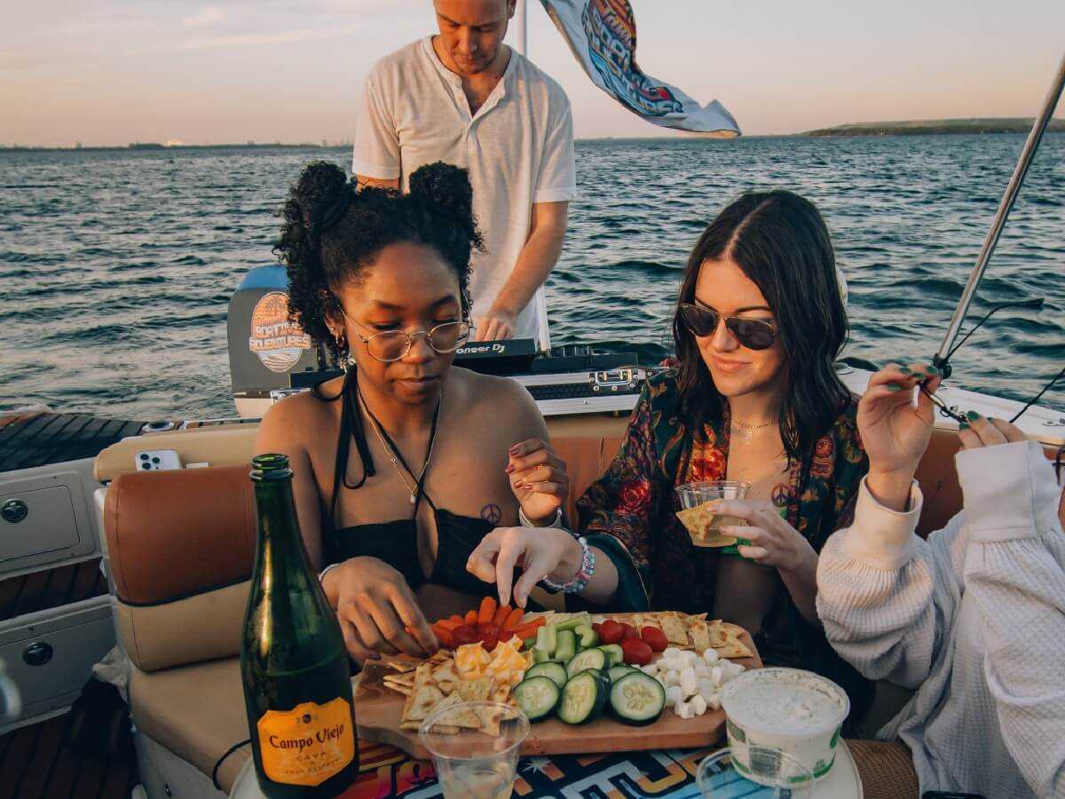 Guests relaxing on deck during an evening cruise.
