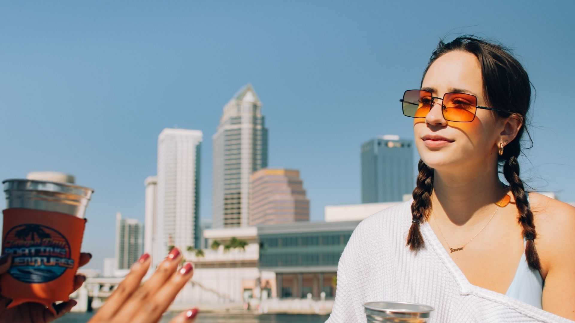 TBBA intern taking group photos during golden hour on Tampa Bay.