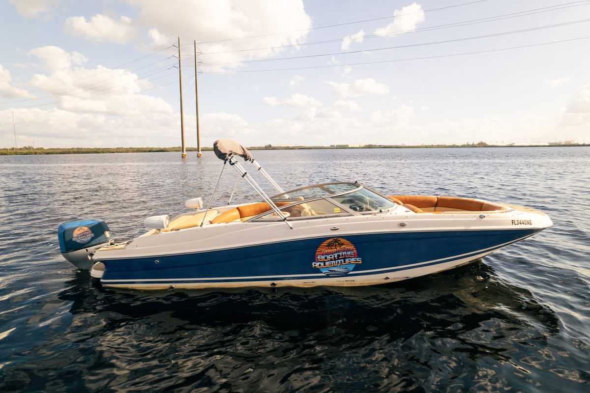 Aerial side view of the charter boat on open water in Tampa Bay.