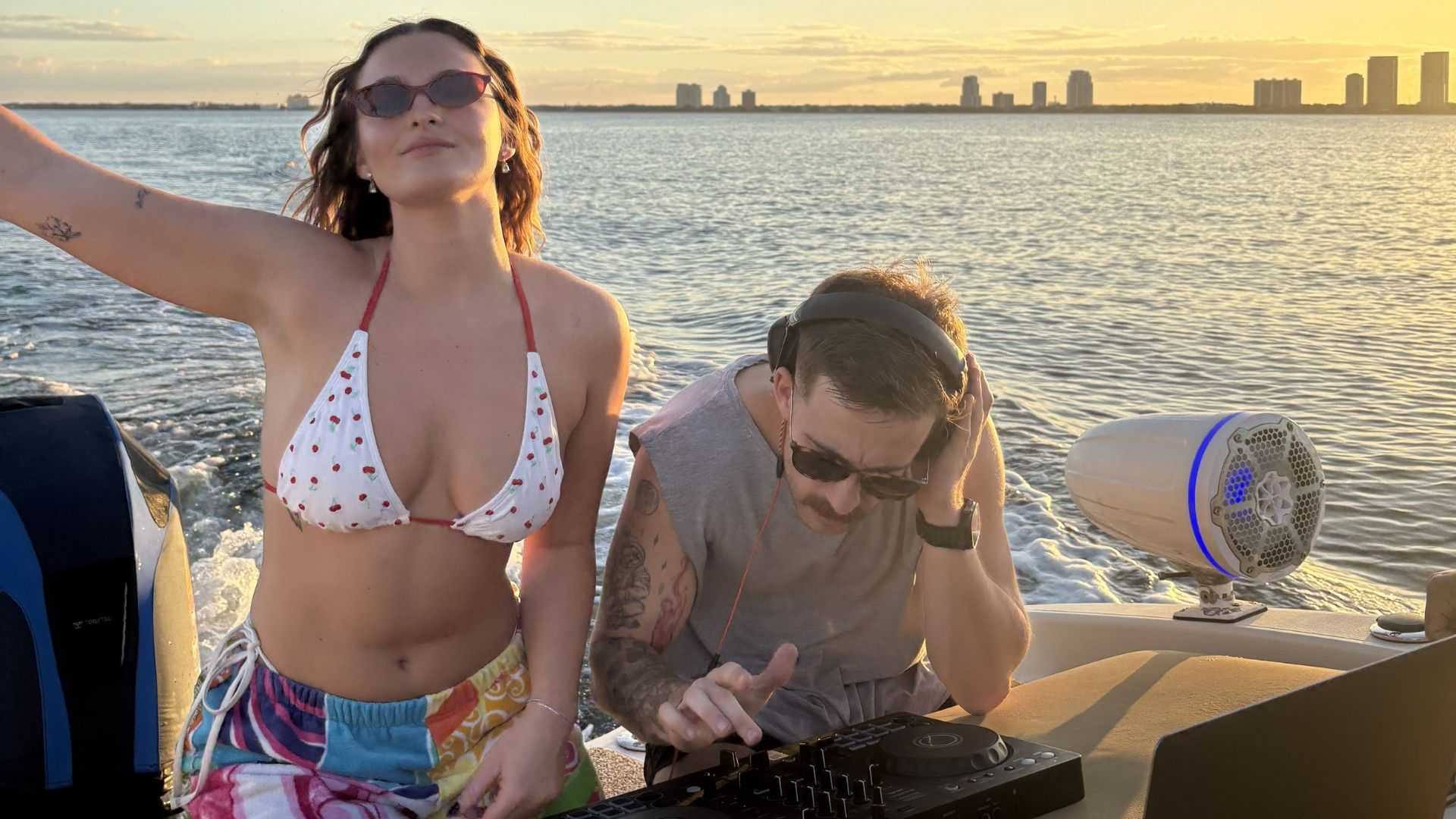Guests dancing on the deck of a Tampa Bay boat party.