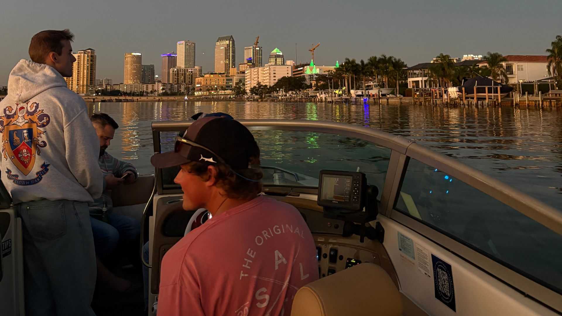 Friends swimming and floating near a local island in Tampa Bay.