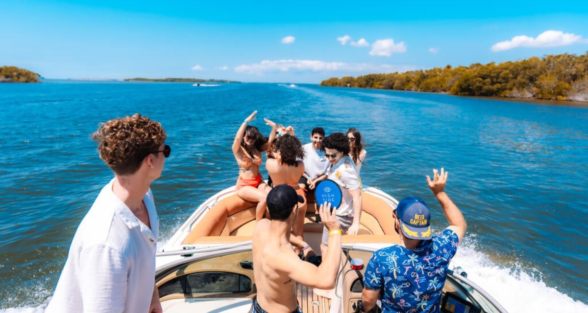 Party boat captain and beautiful girl on a boat in Tampa Bay, FL.