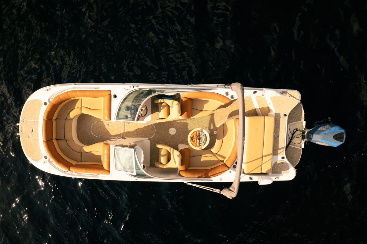 Top-down aerial of Adventure I on open water.